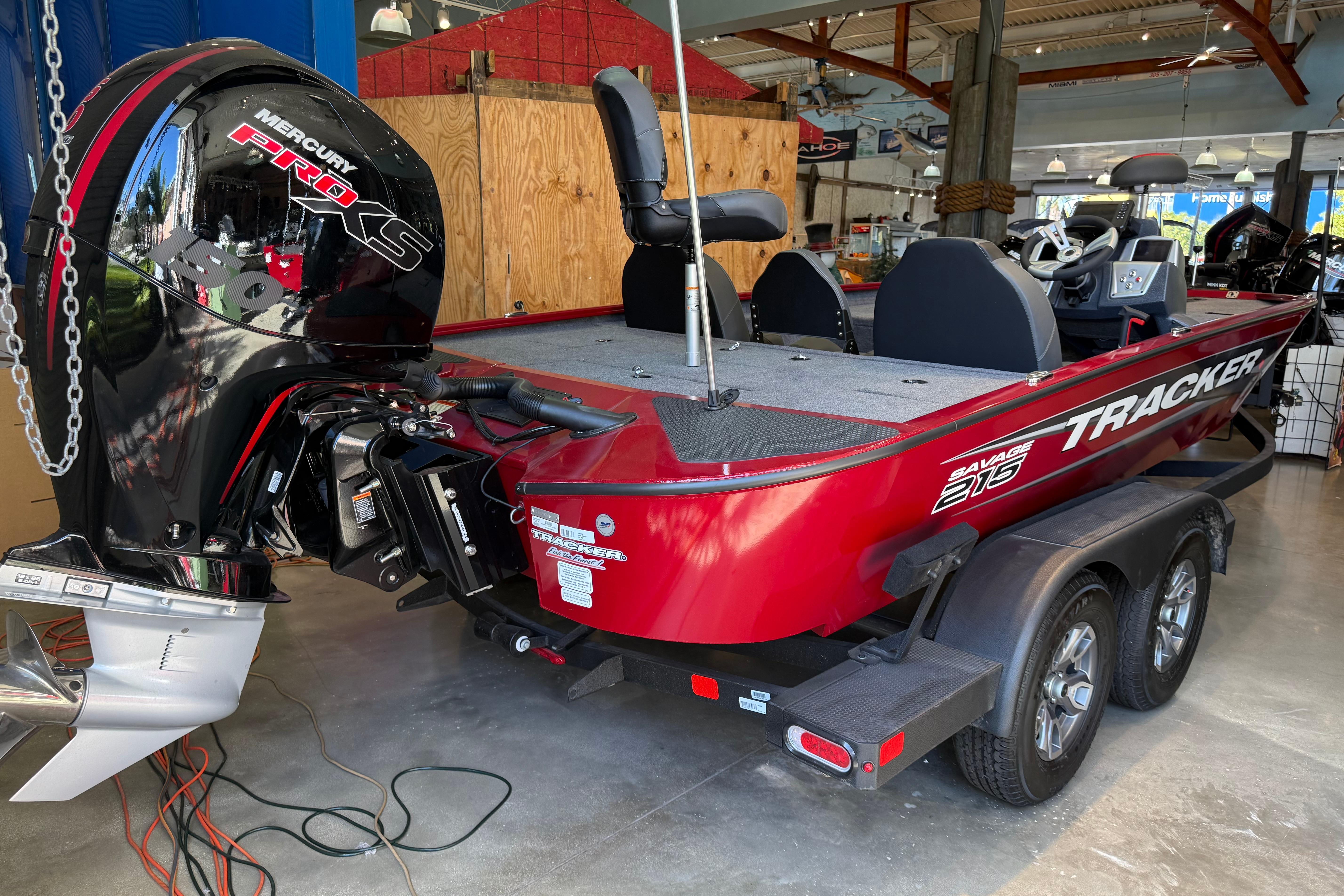2025 Tracker Savage 215 boat with Mercury Pro XS engine in showroom.