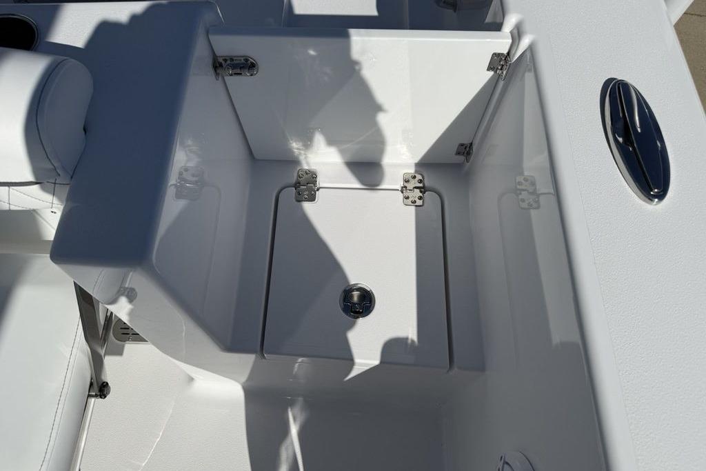 2026 Sportsman Open 232 Center Console boat interior with storage compartment.