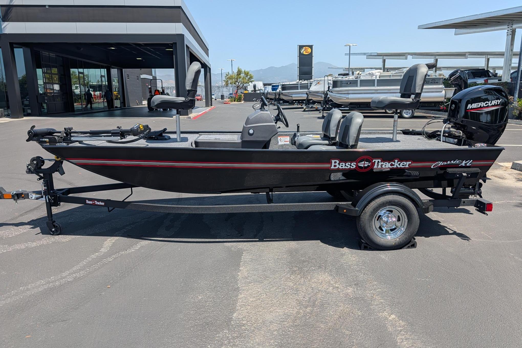 2026 Tracker Bass Tracker Classic XL boat on trailer, parked outdoors.